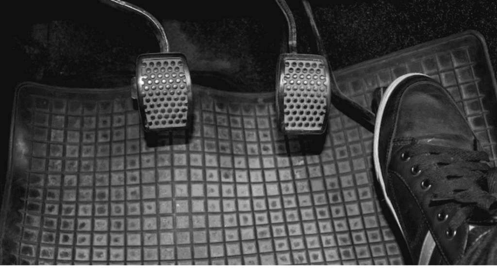 inspecting brake pedal